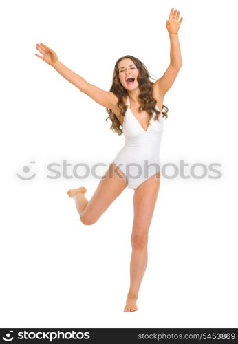 Full length portrait of cheerful young woman in swimsuit