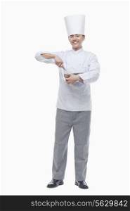 Full Length Portrait of Chef with Whisk