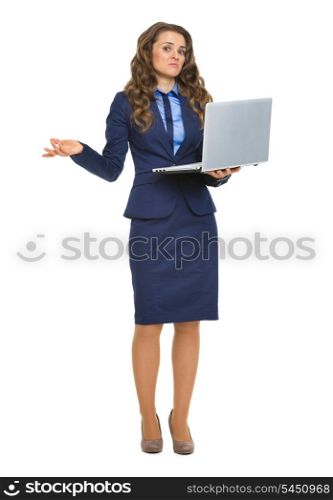 Full length portrait of clueless business woman with laptop shrugging shoulders