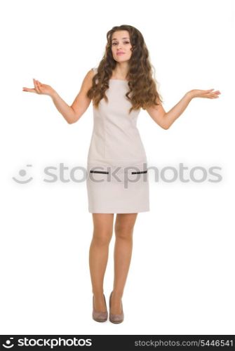 Full length portrait of clueless young woman shrugs