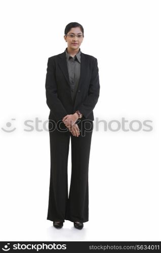 Full length portrait of confident businesswoman standing against white background
