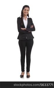 Full length portrait of confident businesswoman with arms crossed isolated over white background