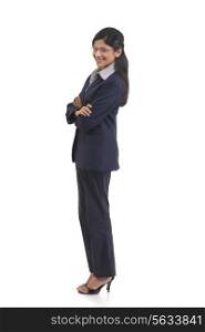 Full length portrait of confident businesswoman with arms crossed isolated over white background