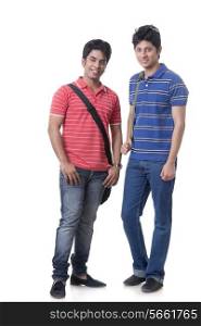 Full length portrait of confident male students against white background