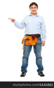 Full length portrait of construction worker pointing on side
