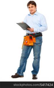 Full length portrait of construction worker with clipboard&#xA;