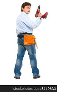 Full length portrait of construction worker with drill look back&#xA;