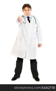Full length portrait of displeased medical doctor showing thumbs down gesture isolated on white&#xA;