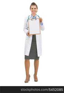 Full length portrait of doctor woman showing blank clipboard