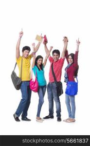 Full length portrait of excited college friends with hands raised against white background