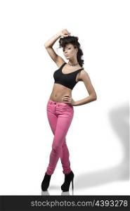 full-length portrait of fashion woman with curly creative hair-style, black top, pink treasure and heels in sexy pose