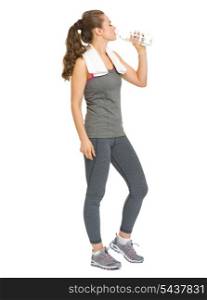 Full length portrait of fitness young woman drinking water