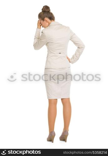 Full length portrait of frustrated business woman . rear view