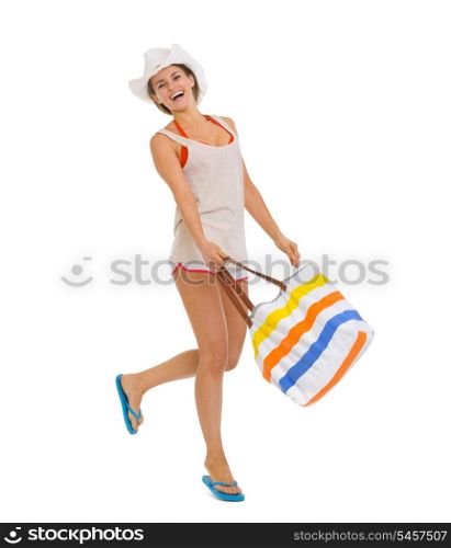 Full length portrait of happy beach young woman jumping