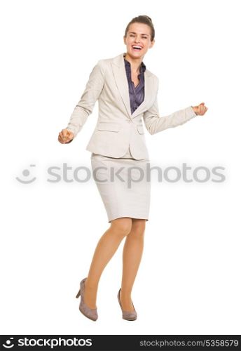 Full length portrait of happy business woman dancing