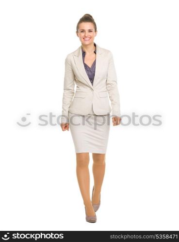 Full length portrait of happy business woman going straight