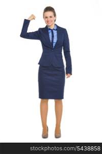 Full length portrait of happy business woman showing biceps