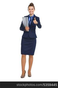 Full length portrait of happy business woman with folder showing thumbs up