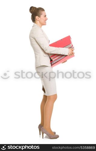 Full length portrait of happy business woman with stack of folders