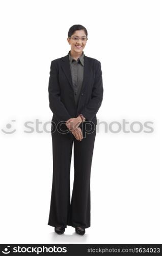Full length portrait of happy businesswoman standing against white background