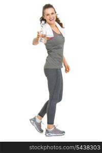Full length portrait of happy fitness young woman giving bottle of water