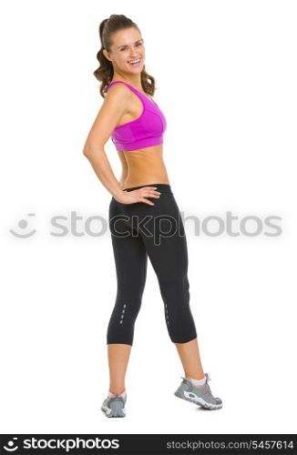 Full length portrait of happy fitness young woman looking out