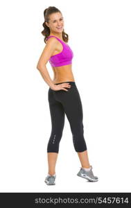 Full length portrait of happy fitness young woman looking out