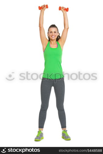 Full length portrait of happy fitness young woman making exercise with dumbbells