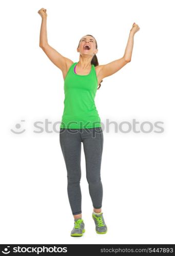 Full length portrait of happy fitness young woman rejoicing success