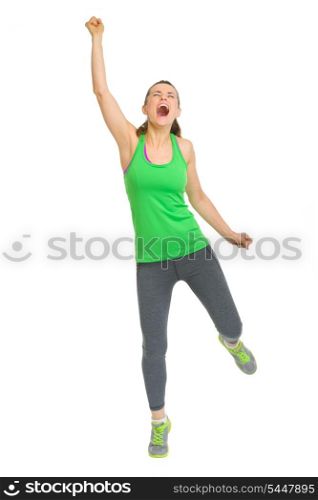 Full length portrait of happy fitness young woman rejoicing success