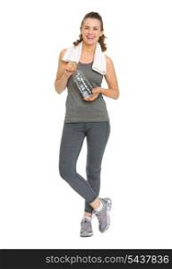 Full length portrait of happy fitness young woman with bottle of water