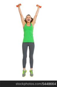 Full length portrait of happy fitness young woman with dumbbells jumping