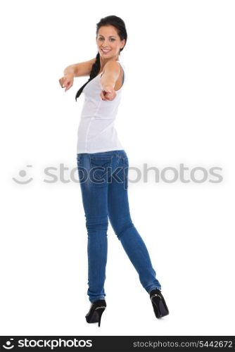 Full length portrait of happy girl pointing in camera