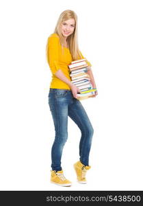 Full length portrait of happy student girl holding stack of books