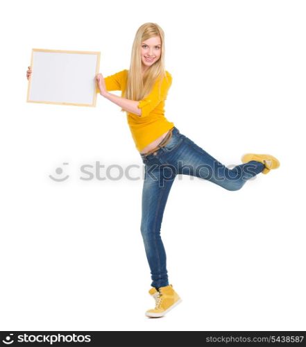 Full length portrait of happy student girl showing blank board