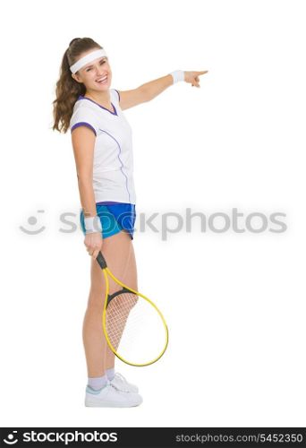 Full length portrait of happy tennis player pointing on copy space