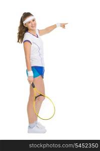 Full length portrait of happy tennis player pointing on copy space
