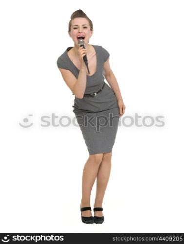 Full length portrait of happy woman singing in microphone. HQ photo. Not oversharpened. Not oversaturated. Full length portrait of happy woman singing in microphone isolated