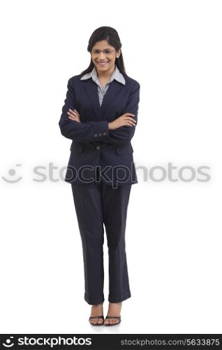 Full length portrait of happy young businesswoman with arms crossed isolated over white background