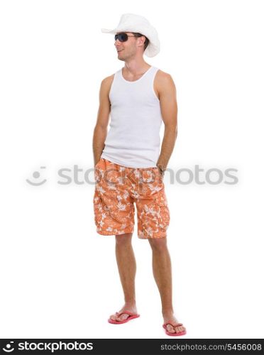Full length portrait of happy young man looking on copy space
