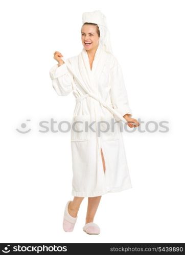Full length portrait of happy young woman in bathrobe
