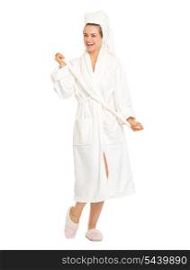 Full length portrait of happy young woman in bathrobe