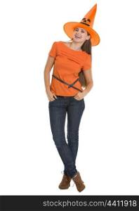 Full length portrait of happy young woman in Halloween hat