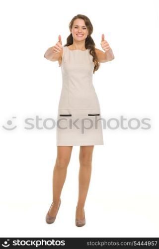 Full length portrait of happy young woman showing thumbs up