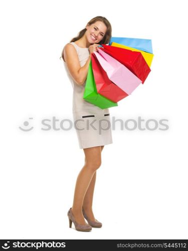 Full length portrait of happy young woman with shopping bags