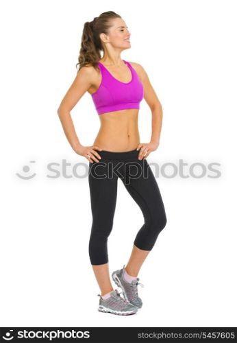 Full length portrait of healthy young woman looking on copy space