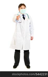 Full length portrait of medical doctor in mask holding blood sample in hand isolated on white&#xA;