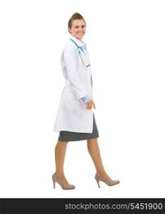 Full length portrait of medical doctor woman going sideways