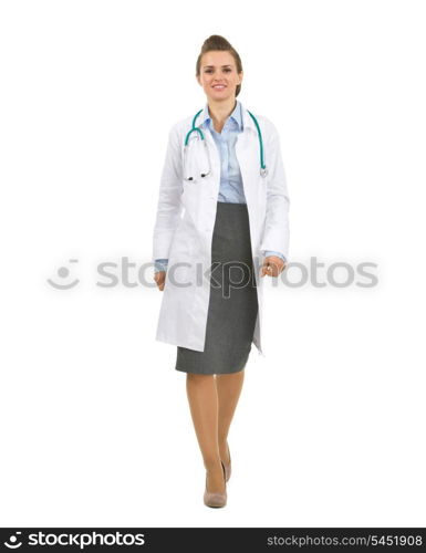 Full length portrait of medical doctor woman going straight