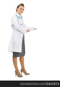 Full length portrait of medical doctor woman inviting to come